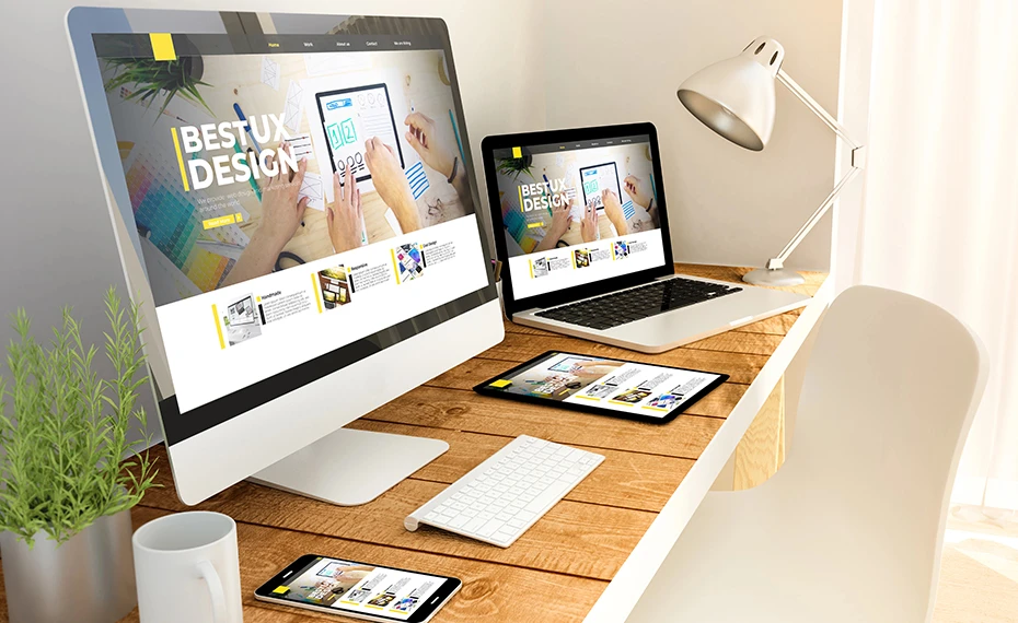 Digital devices on a wooden table showcasing ux design, responsive layouts, and affordable website designs.