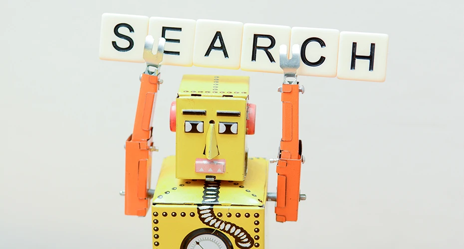 Toy robot as a search engine bot exploring an online website’s xml sitemap for seo
